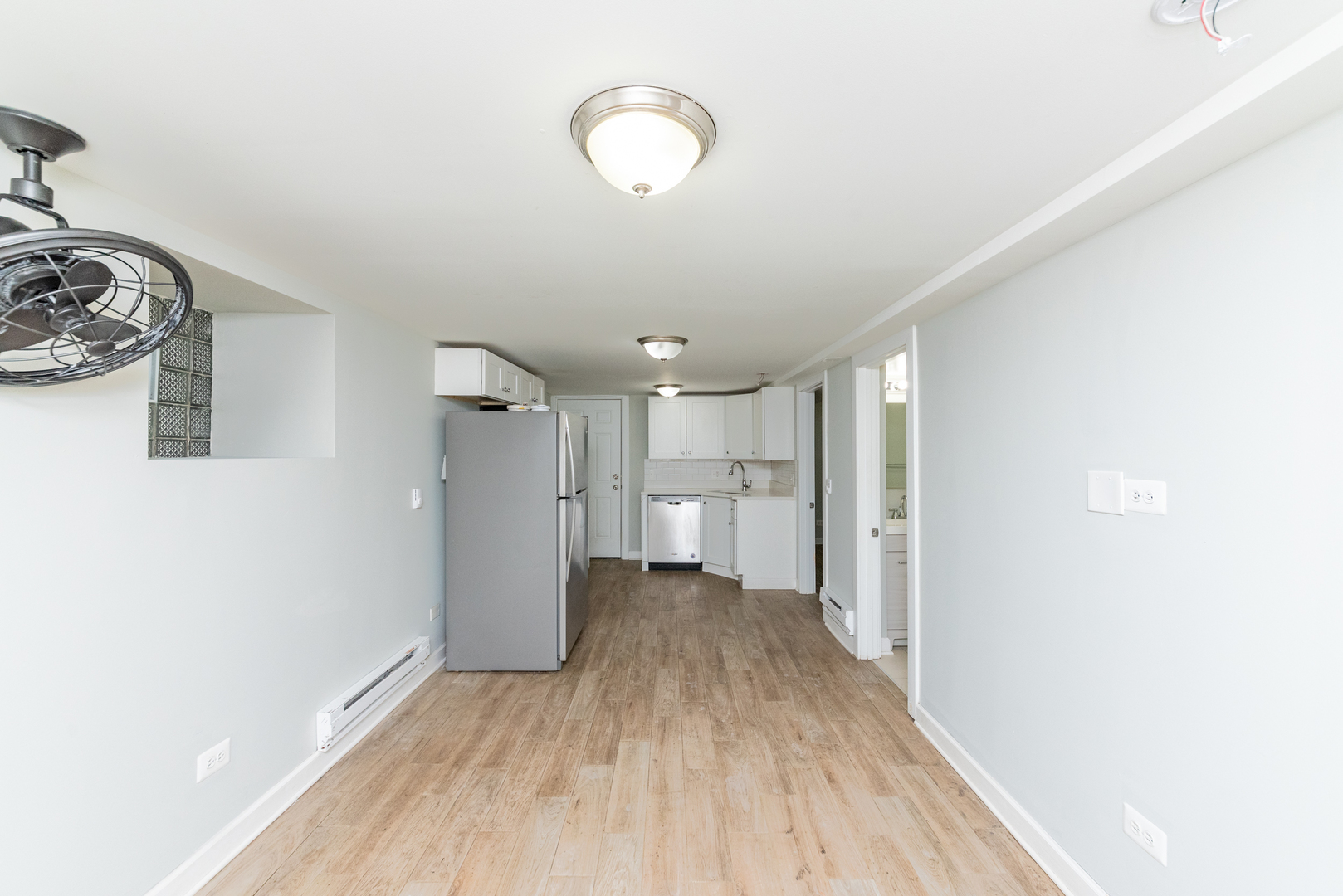 1431 West Flournoy Street, Unit G Chicago, IL 60607 - Photo 4 of 12 a view of a room with wooden floor