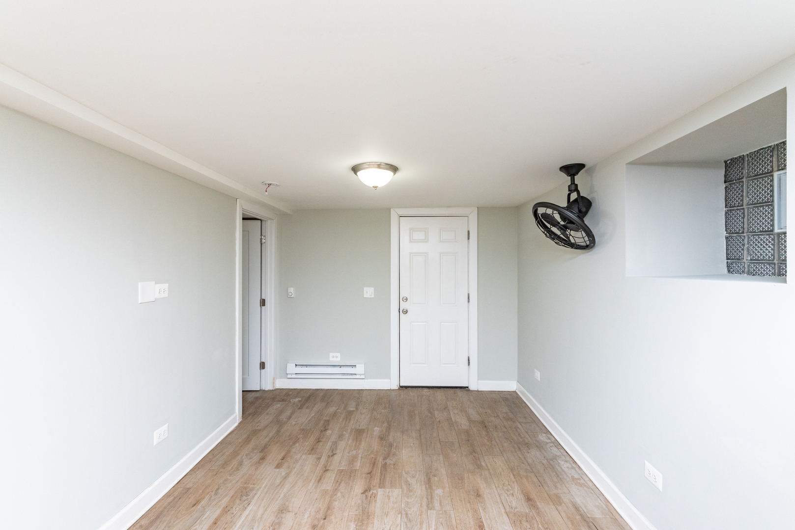 1431 West Flournoy Street, Unit G Chicago, IL 60607 - Photo 7 of 12 a view of a room with wooden floor and window