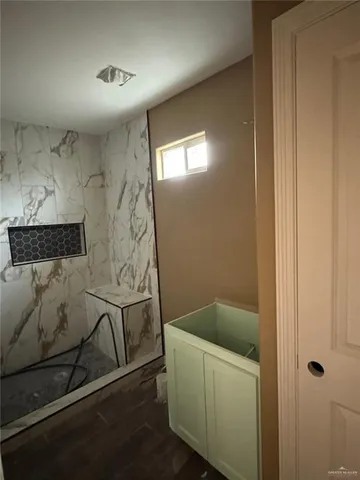 a room with a cabinets and a sink