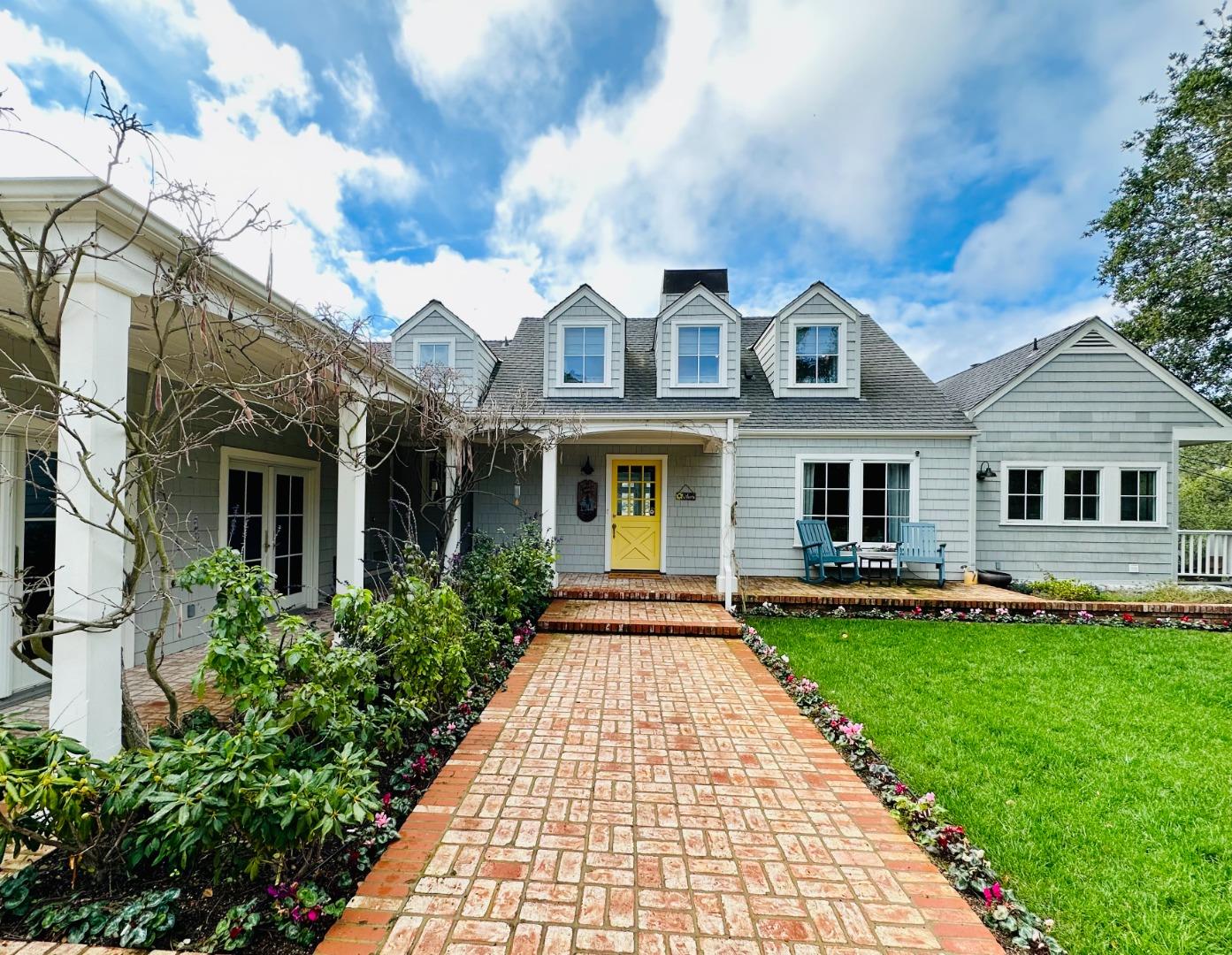 1075 Godetia Drive Woodside, CA 94062 - Photo 2 of 33 a front view of a house with a garden