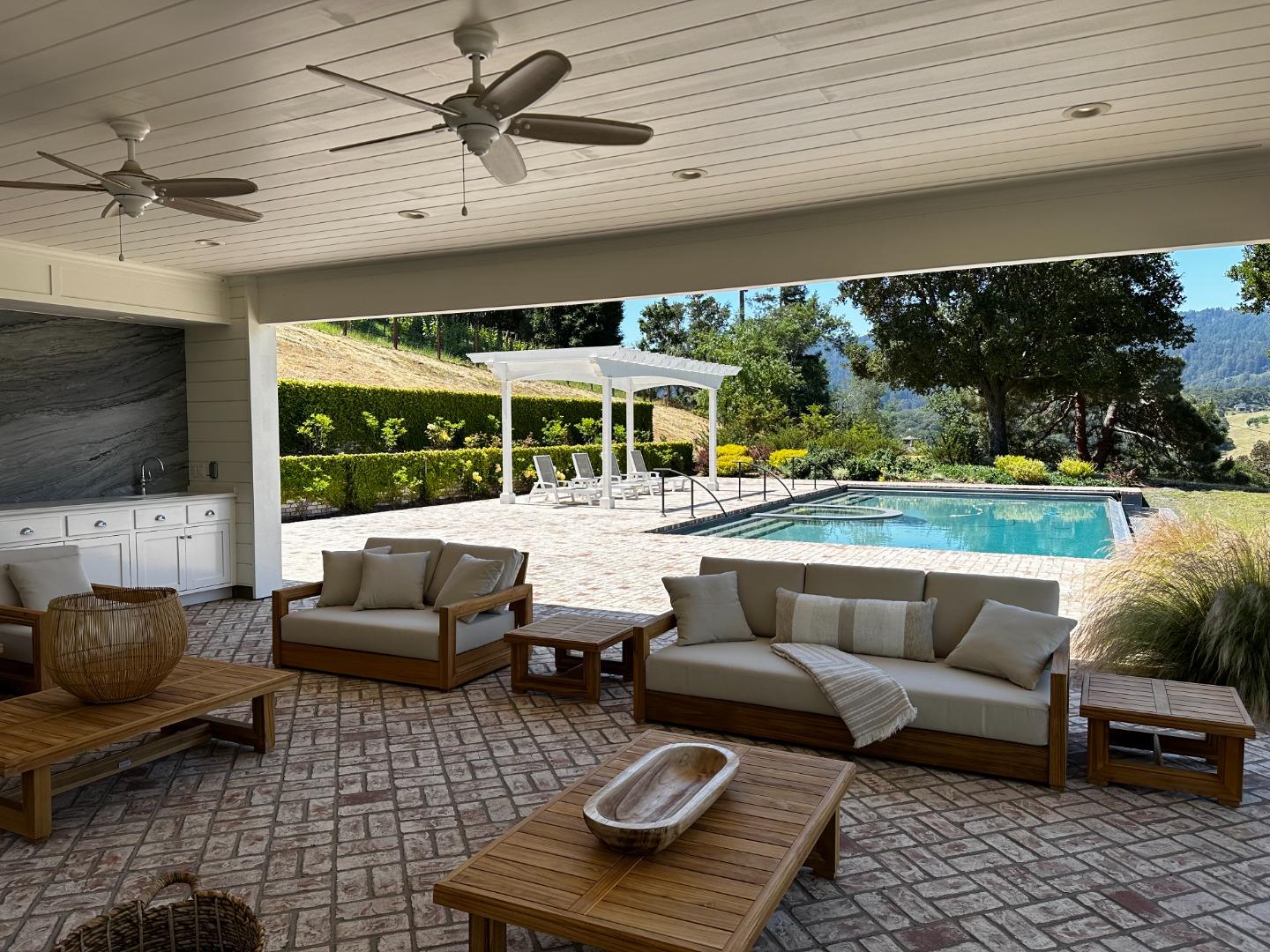 1075 Godetia Drive Woodside, CA 94062 - Photo 23 of 33 a outdoor living space with furniture and a fireplace
