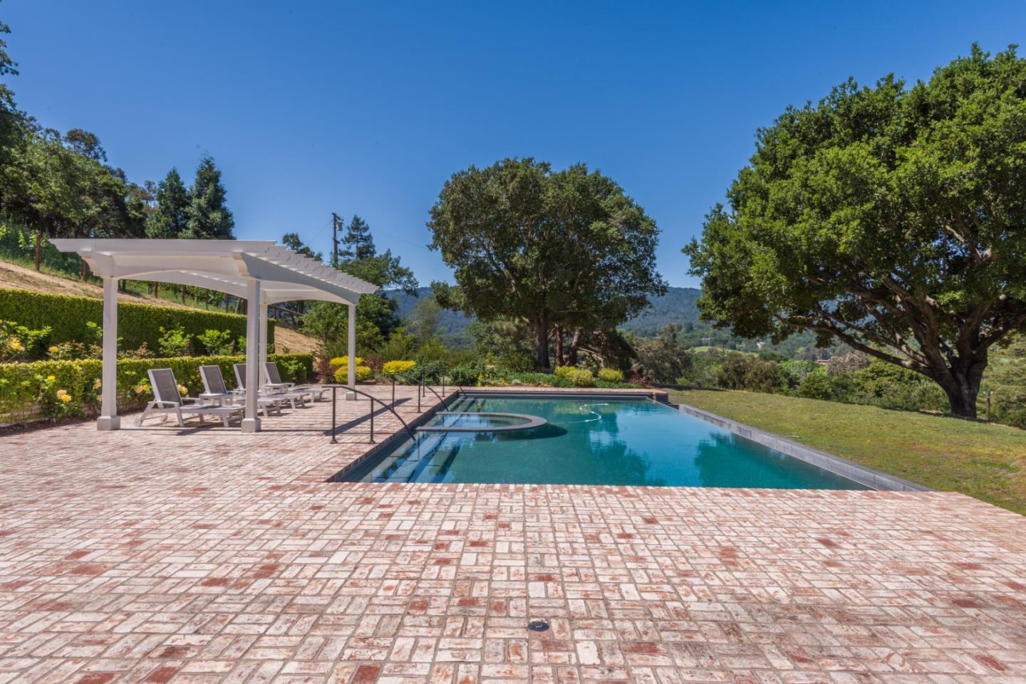 1075 Godetia Drive Woodside, CA 94062 - Photo 24 of 33 a view of swimming pool with a patio and a yard