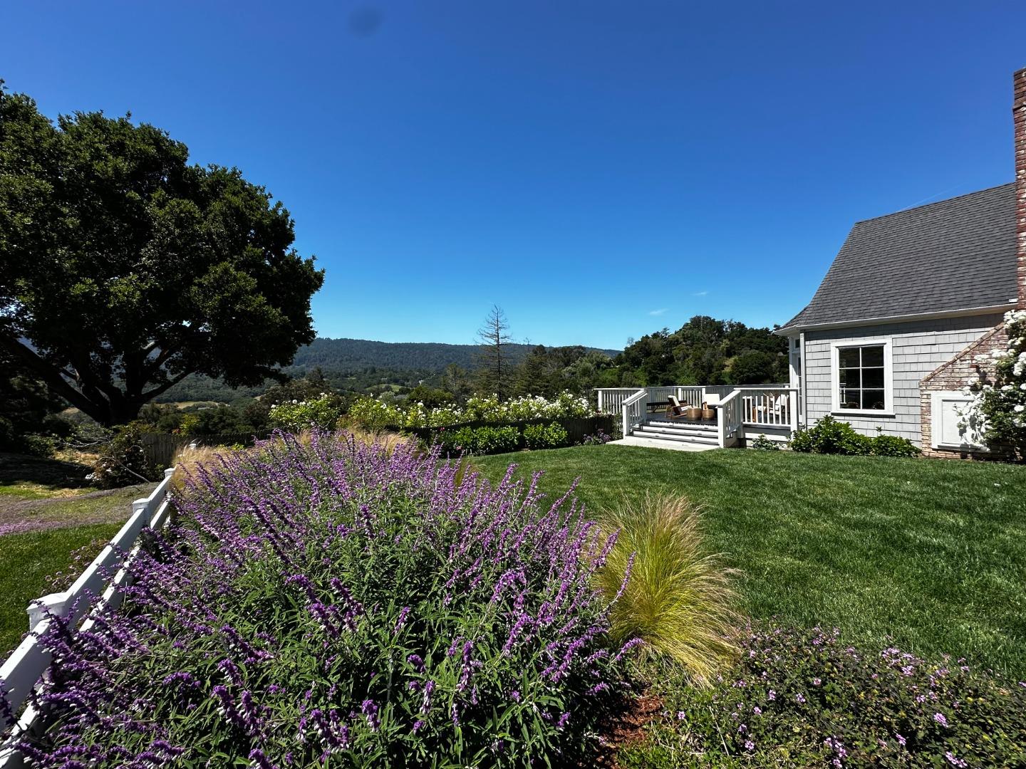 1075 Godetia Drive Woodside, CA 94062 - Photo 3 of 33 a view of a lake with a house in the background