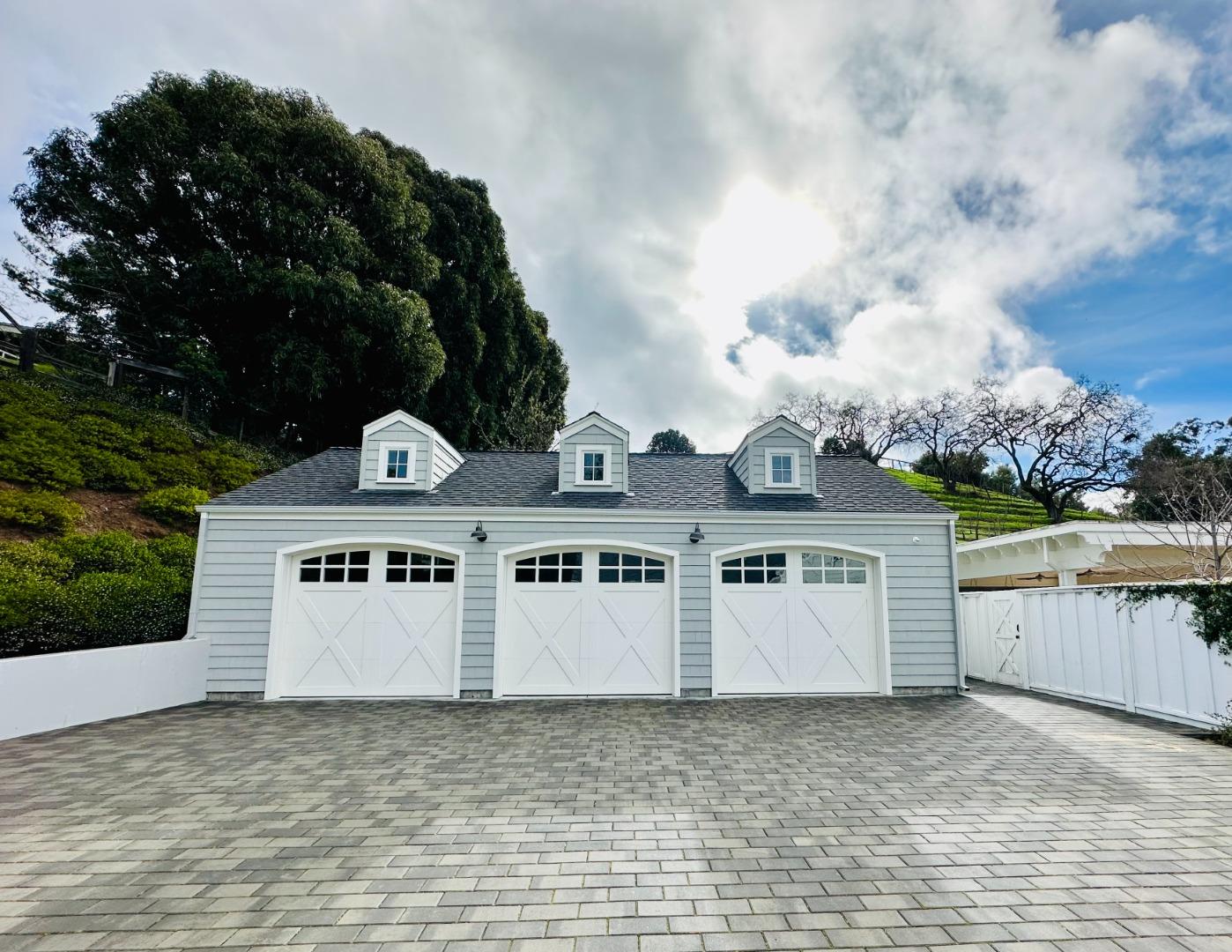 1075 Godetia Drive Woodside, CA 94062 - Photo 31 of 33 an aerial view of a house with garden space and a car parked in front of it