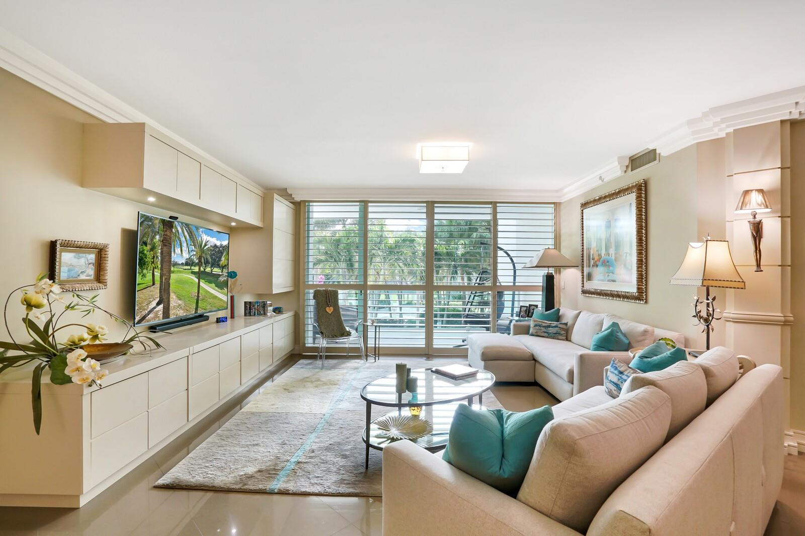 550 Southeast Mizner Boulevard, Unit B209 Boca Raton, FL 33432 - Photo 37 of 78 a living room with furniture and a flat screen tv