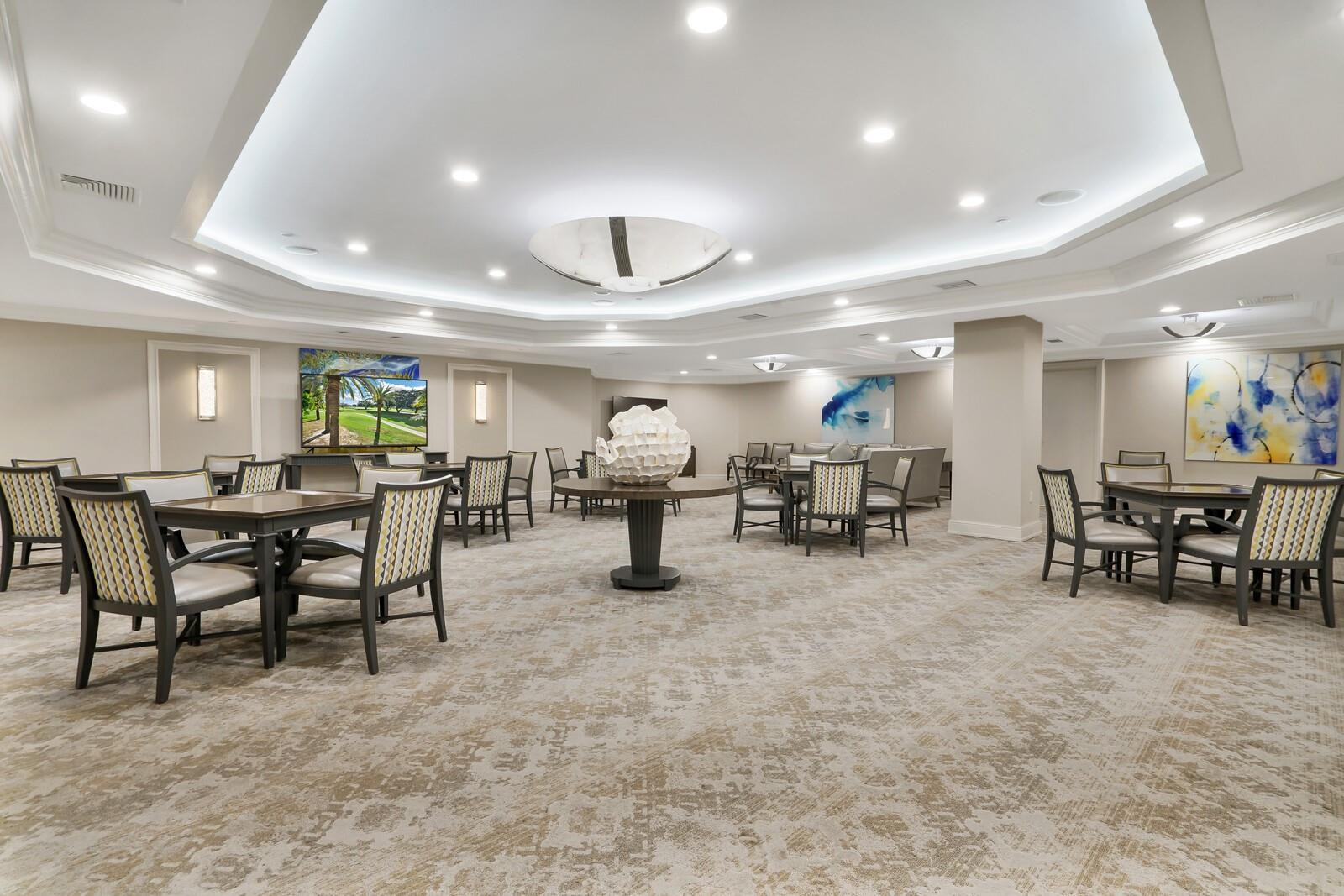 550 Southeast Mizner Boulevard, Unit B209 Boca Raton, FL 33432 - Photo 43 of 78 a room with lots of furniture and a table