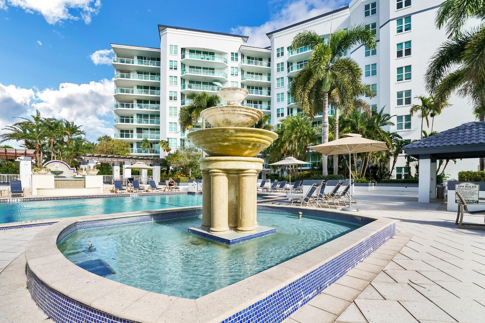 550 Southeast Mizner Boulevard, Unit B209 Boca Raton, FL 33432 - Photo 44 of 78 a view of a swimming pool with a patio