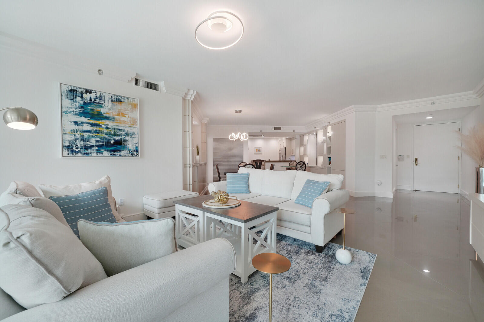 550 Southeast Mizner Boulevard, Unit B209 Boca Raton, FL 33432 - Photo 5 of 78 a living room with furniture kitchen view and a table