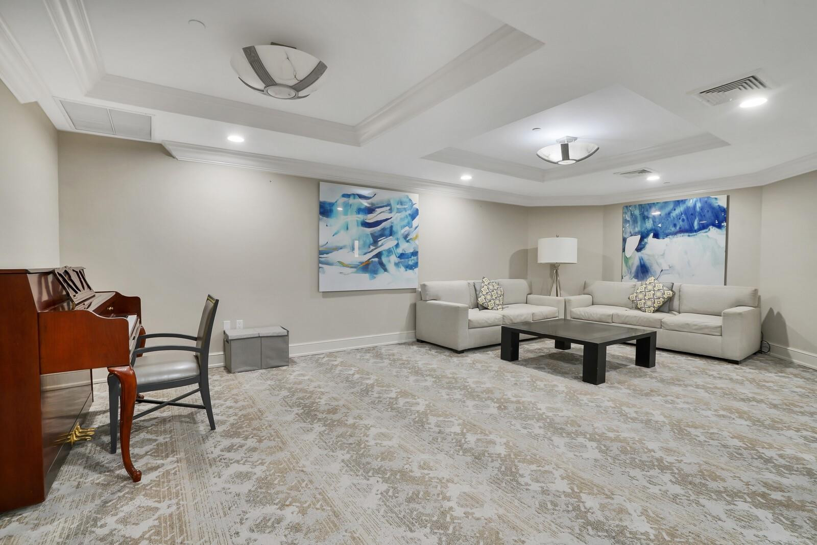 550 Southeast Mizner Boulevard, Unit B209 Boca Raton, FL 33432 - Photo 56 of 78 a living room with furniture and a rug