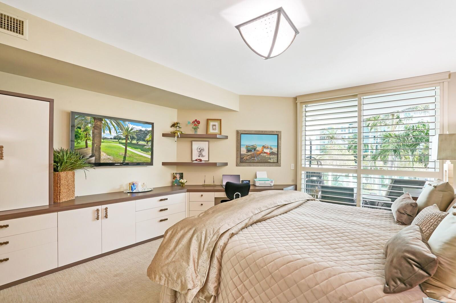 550 Southeast Mizner Boulevard, Unit B209 Boca Raton, FL 33432 - Photo 69 of 78 a bedroom with a large bed and a window