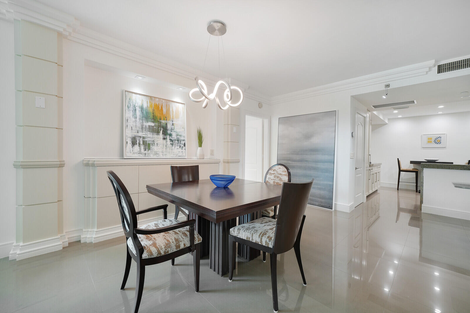 550 Southeast Mizner Boulevard, Unit B209 Boca Raton, FL 33432 - Photo 7 of 78 a view of a dining room with furniture and wooden floor