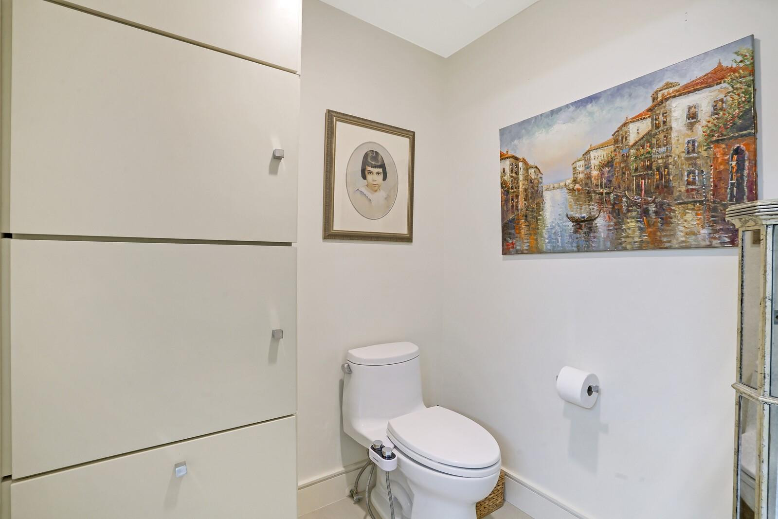 550 Southeast Mizner Boulevard, Unit B209 Boca Raton, FL 33432 - Photo 74 of 78 a white toilet sitting next to a bathroom sink