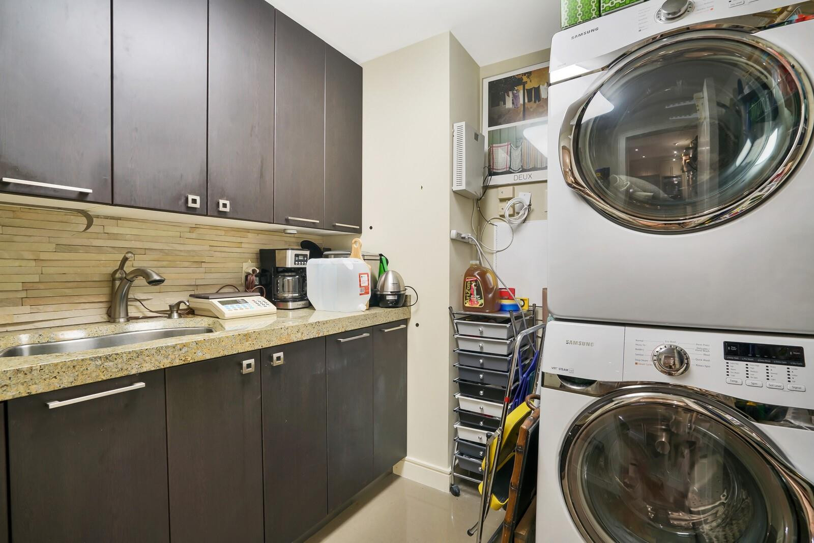 550 Southeast Mizner Boulevard, Unit B209 Boca Raton, FL 33432 - Photo 76 of 78 a utility room with sink dryer and washer