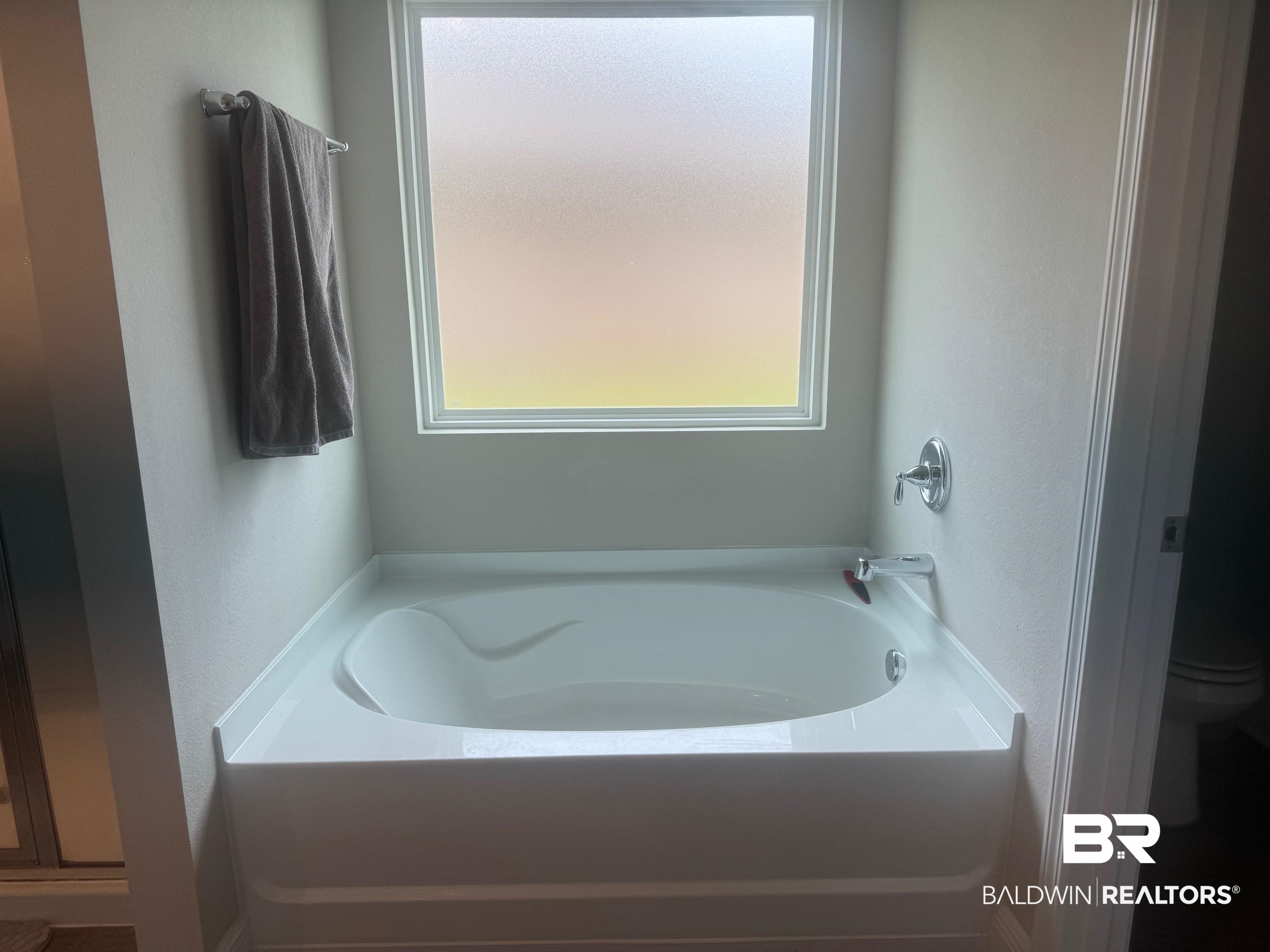 24903 Spectacular Bid Loop Daphne, AL 36526 - Photo 17 of 37 Full bath featuring a garden tub and toilet