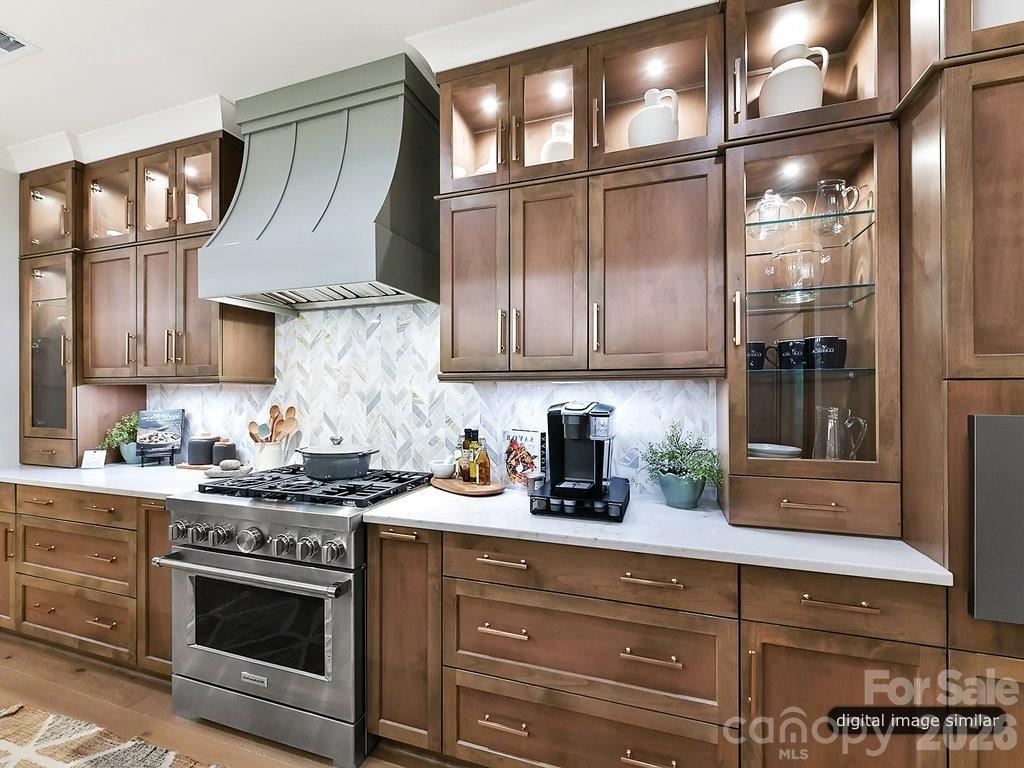 1002 Kingbird Lane, Unit 7 Clover, SC 29710 - Photo 11 of 40 a kitchen with stainless steel appliances granite countertop a stove and cabinets