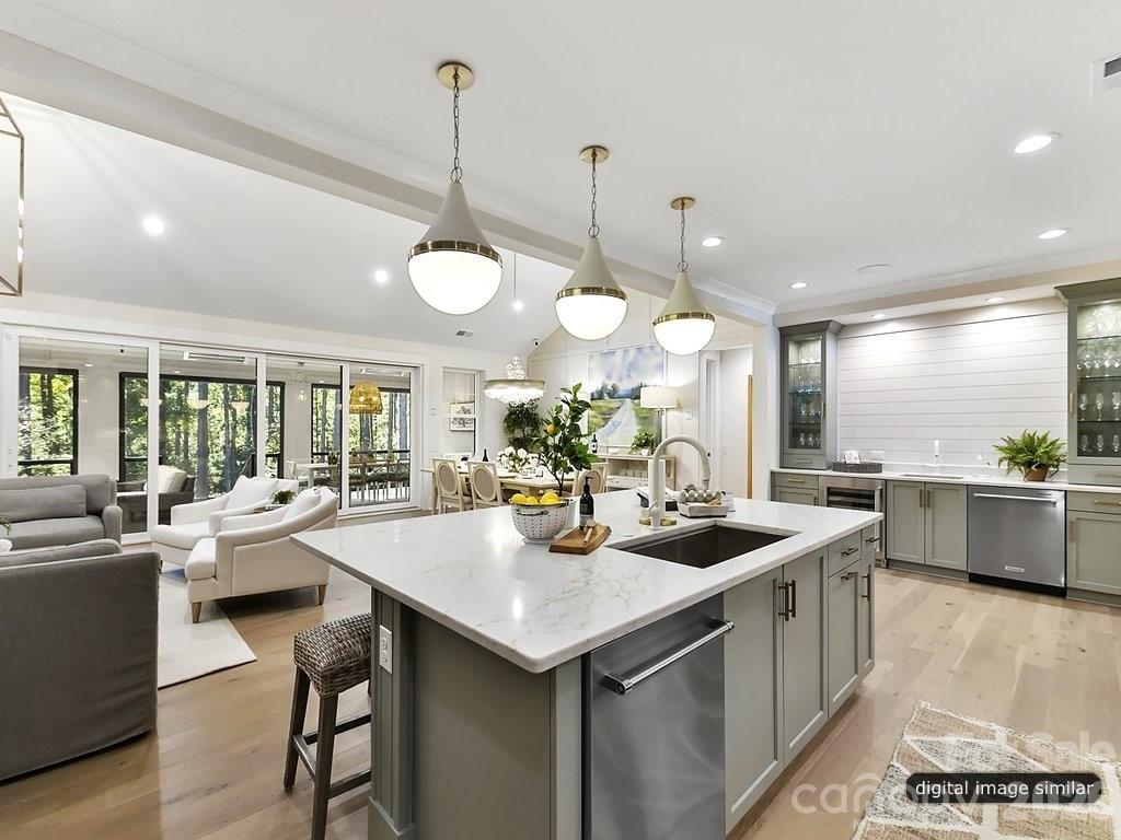 1002 Kingbird Lane, Unit 7 Clover, SC 29710 - Photo 15 of 40 a kitchen with counter space appliances and a large window