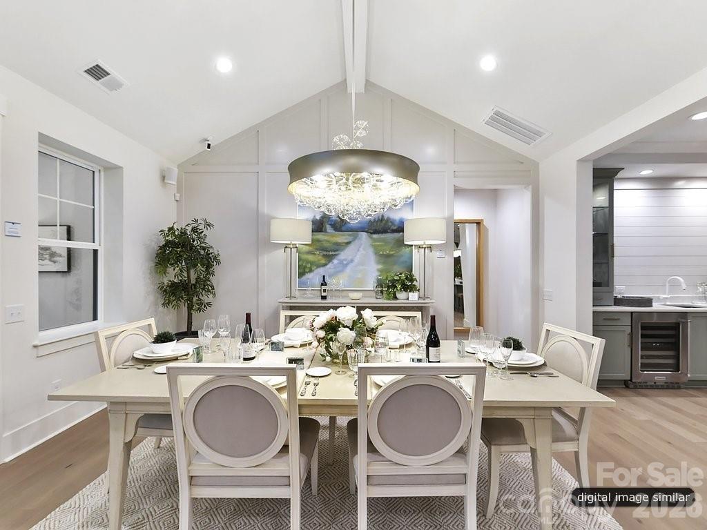 1002 Kingbird Lane, Unit 7 Clover, SC 29710 - Photo 16 of 40 a view of a dining room with furniture and chandelier