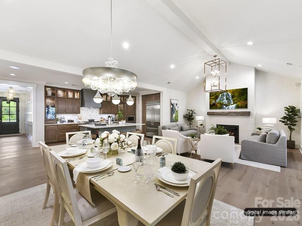 1002 Kingbird Lane, Unit 7 Clover, SC 29710 - Photo 17 of 40 a view of a dining room with furniture and wooden floor