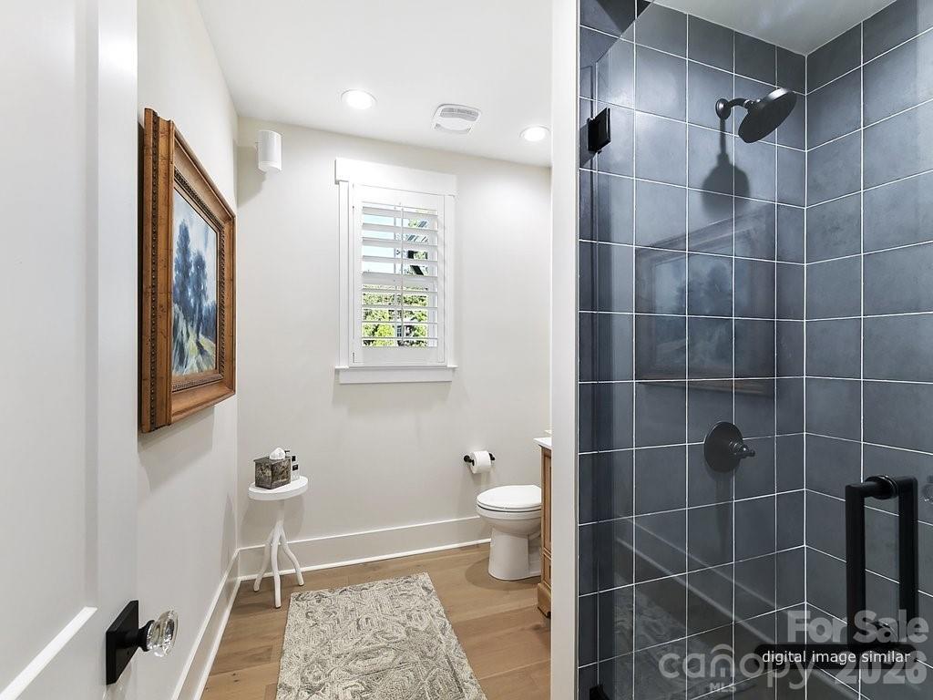 1002 Kingbird Lane, Unit 7 Clover, SC 29710 - Photo 25 of 40 a bathroom with a toilet and a shower