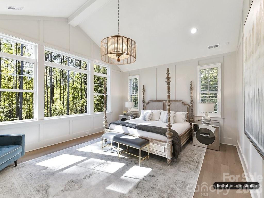 1002 Kingbird Lane, Unit 7 Clover, SC 29710 - Photo 26 of 40 a spacious bedroom with a bed and a large window