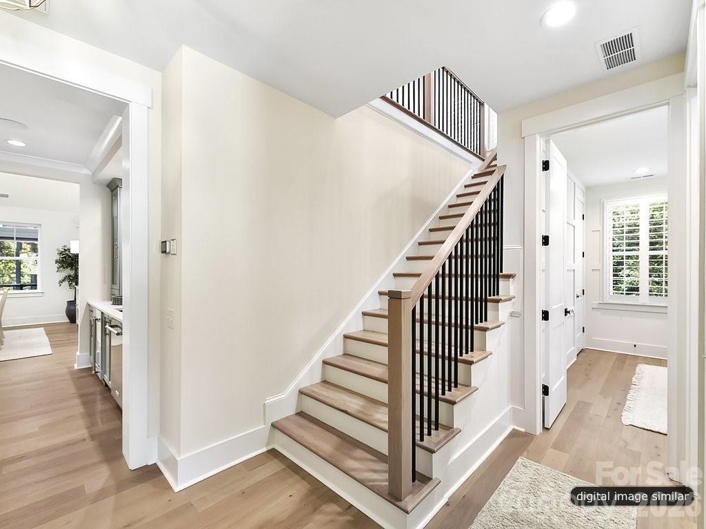 1002 Kingbird Lane, Unit 7 Clover, SC 29710 - Photo 33 of 40 a view of a hallway with wooden floor and entryway