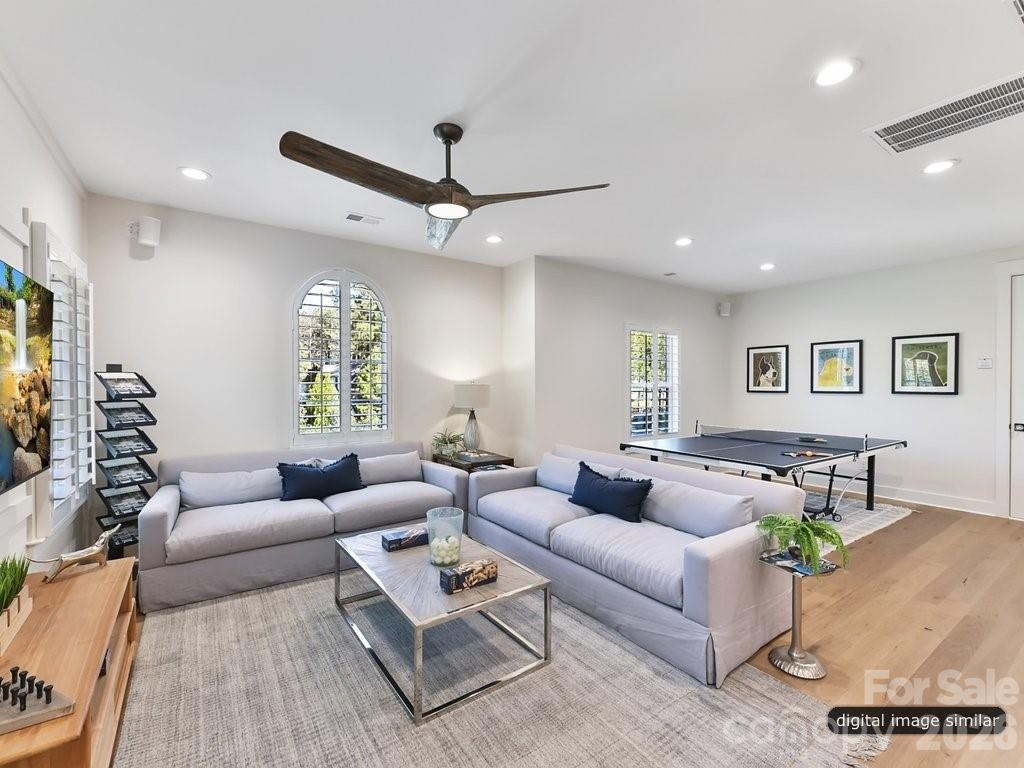 1002 Kingbird Lane, Unit 7 Clover, SC 29710 - Photo 35 of 40 a living room with furniture and a wooden floor