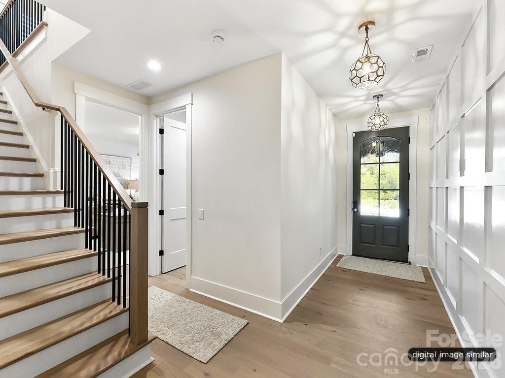 1002 Kingbird Lane, Unit 7 Clover, SC 29710 - Photo 5 of 40 a view of a hallway with windows and stairs