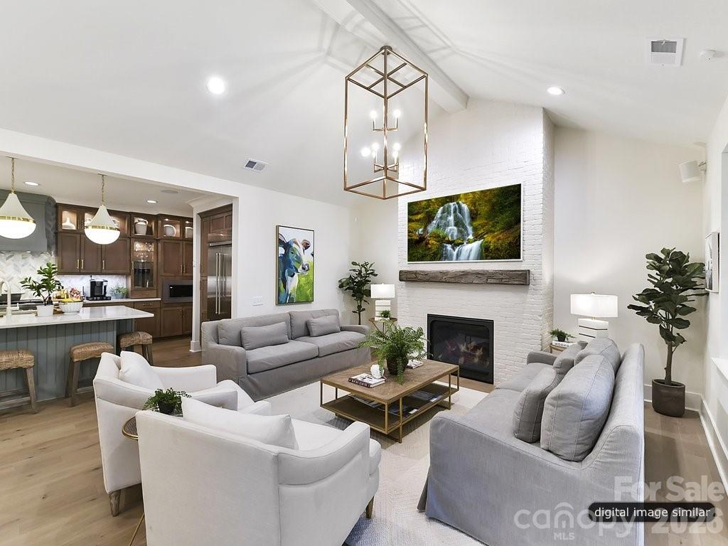 1002 Kingbird Lane, Unit 7 Clover, SC 29710 - Photo 6 of 40 a living room with furniture a fireplace and a flat screen tv