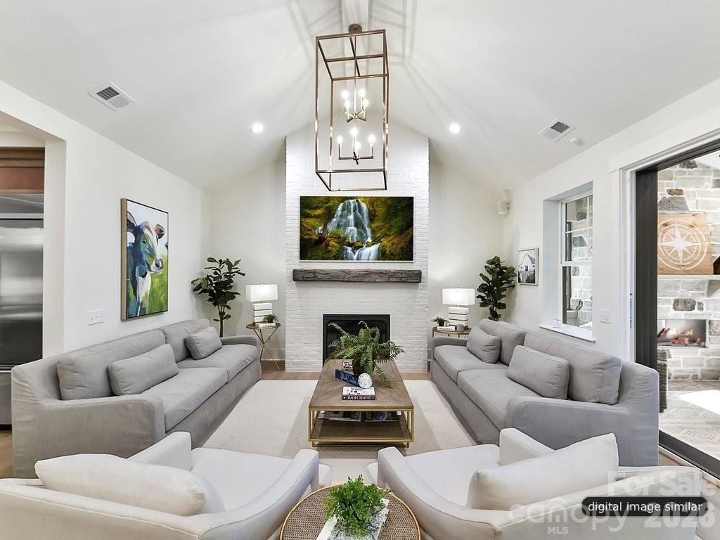 1002 Kingbird Lane, Unit 7 Clover, SC 29710 - Photo 7 of 40 a living room with furniture a fireplace and a flat screen tv