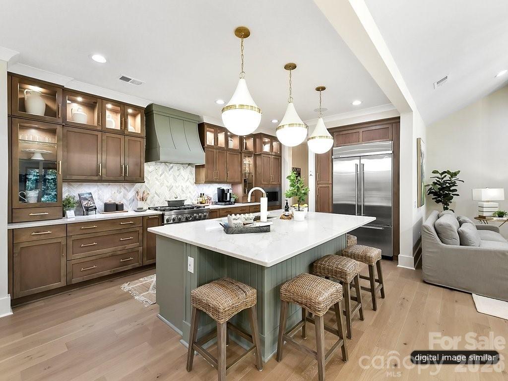 1002 Kingbird Lane, Unit 7 Clover, SC 29710 - Photo 9 of 40 a large kitchen with a table and chairs