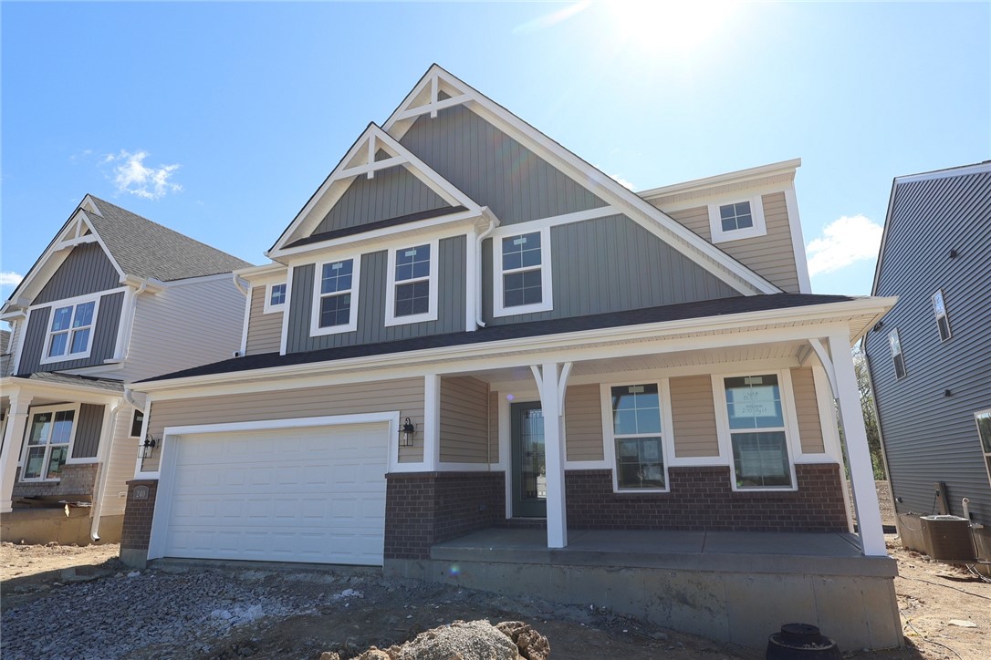 240 Tilly Court, Unit 5 Springboro, OH 45066 - Photo 19 of 26 This newly constructed home features a welcoming covered porch, perfect for enjoying outdoor moments.