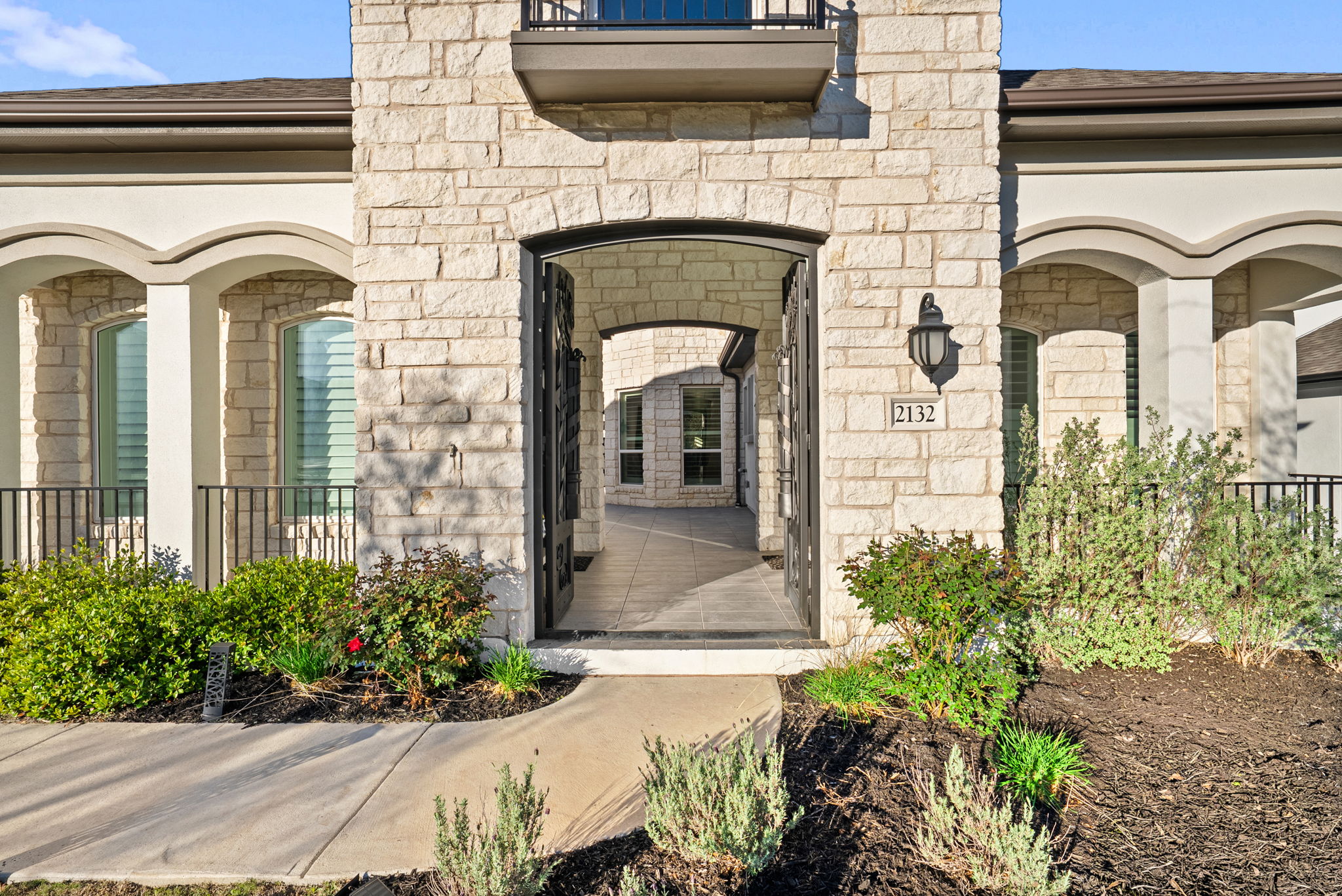 2132 Novara Trail Leander, TX 78641 - Photo 6 of 40 Doorway to property featuring stone siding