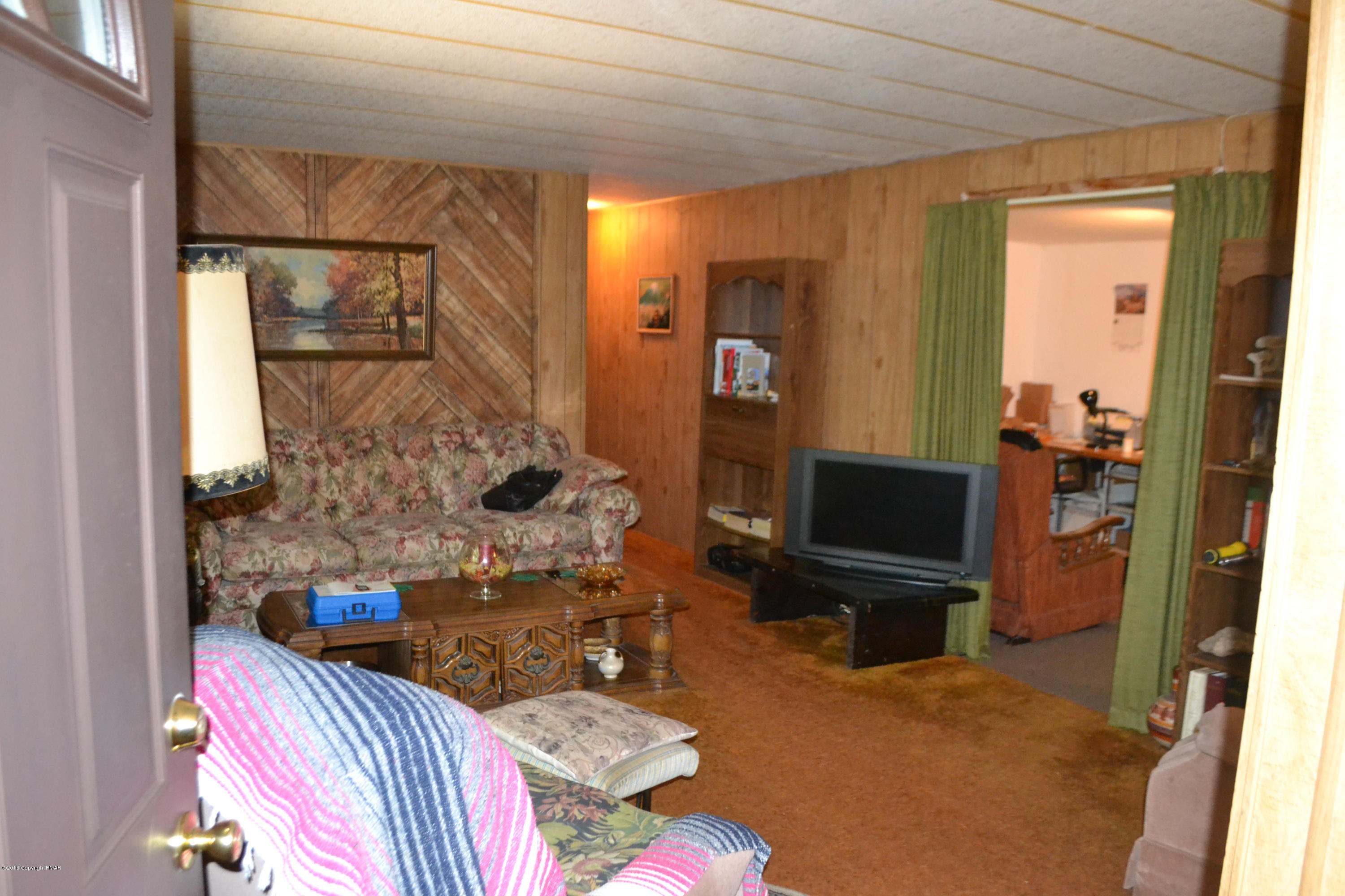 130 Stadden Road Stroudsburg, PA 18360 - Photo 21 of 24 a living room with furniture and a flat screen tv