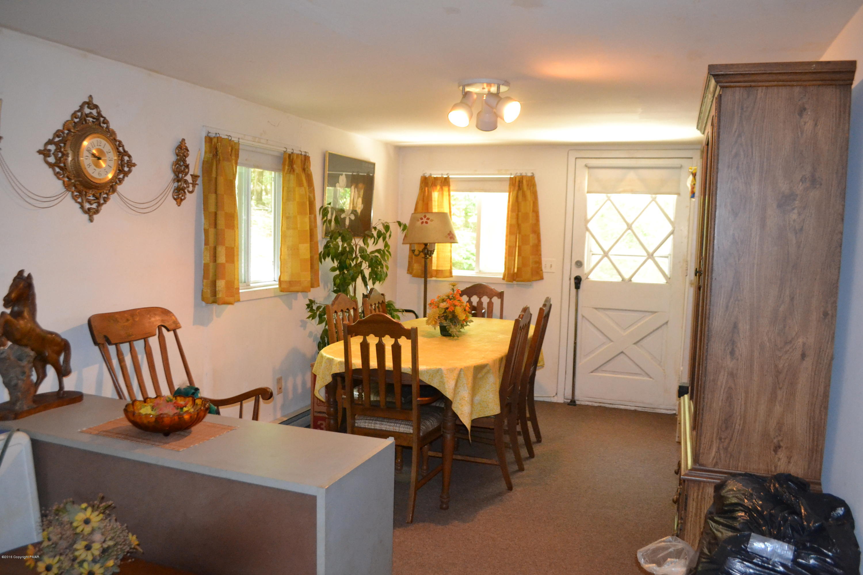 130 Stadden Road Stroudsburg, PA 18360 - Photo 6 of 24 a view of a dining room with furniture and a window