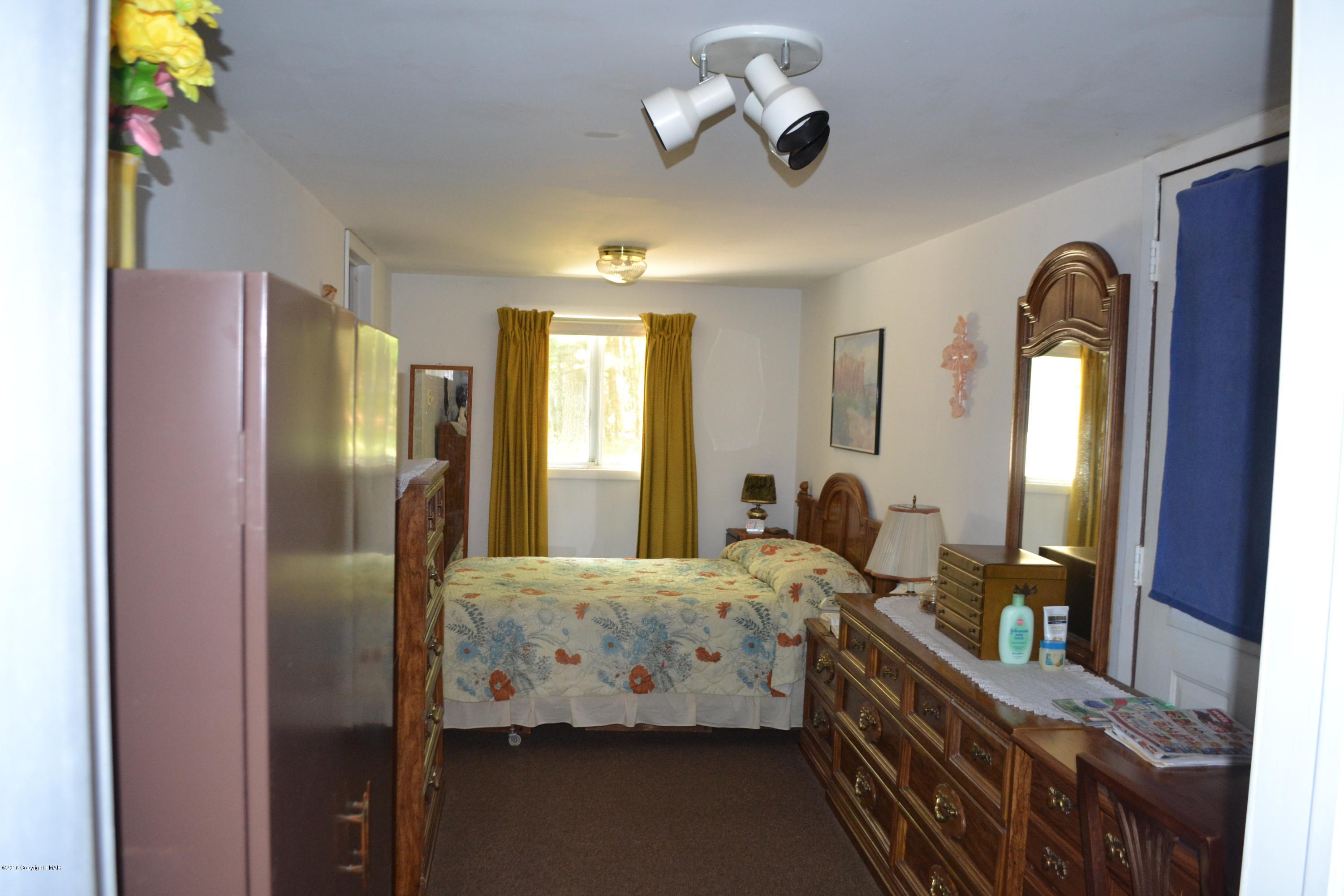 130 Stadden Road Stroudsburg, PA 18360 - Photo 7 of 24 a bedroom with bed and wooden floor