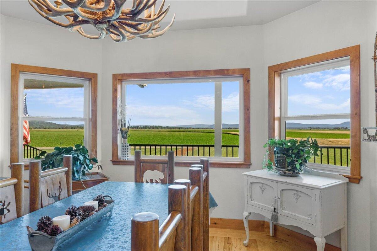 41494 Gomez Road Fall River Mills, CA 96028 - Photo 16 of 92 a dining room with furniture a flat screen tv and a potted plant