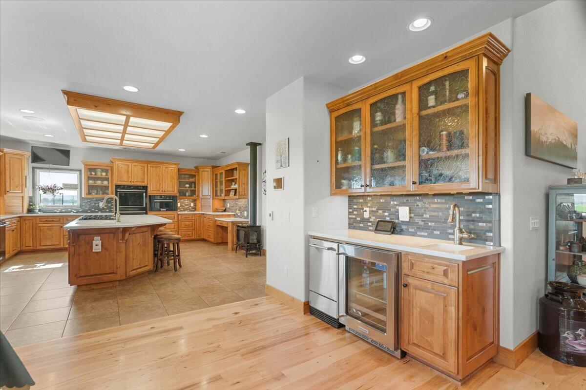 41494 Gomez Road Fall River Mills, CA 96028 - Photo 17 of 92 a open kitchen with stainless steel appliances granite countertop a stove a sink and a refrigerator