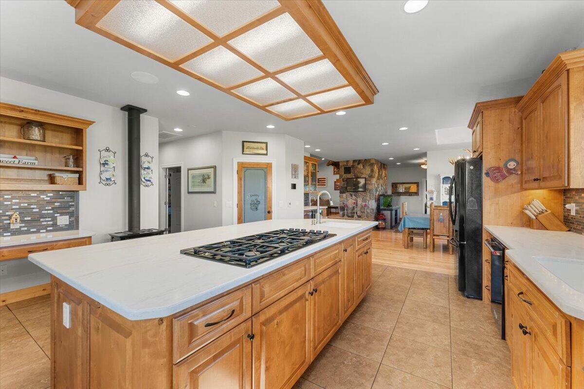41494 Gomez Road Fall River Mills, CA 96028 - Photo 25 of 92 a kitchen with stainless steel appliances granite countertop a sink stove and refrigerator