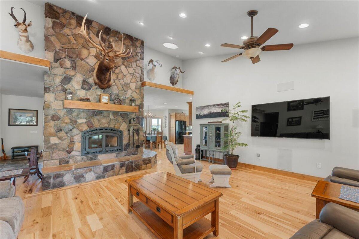 41494 Gomez Road Fall River Mills, CA 96028 - Photo 28 of 92 a living room with furniture a flat screen tv and a fireplace