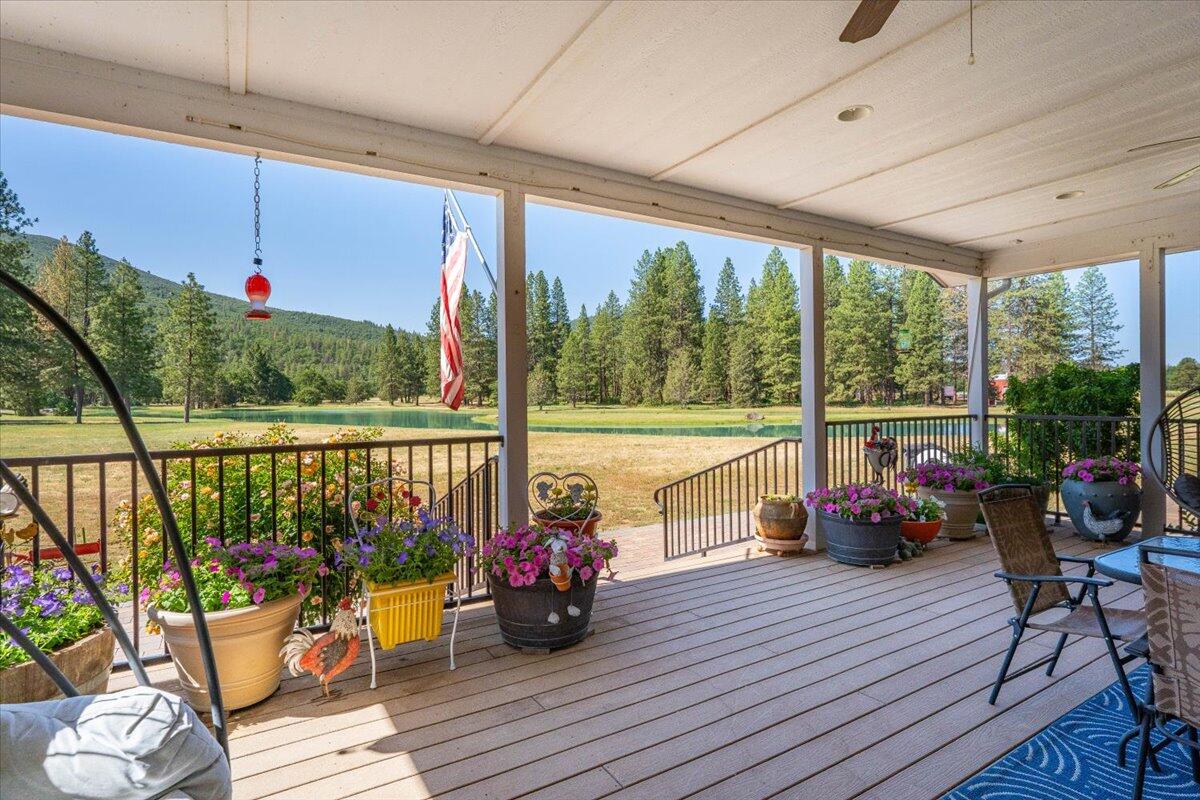 41494 Gomez Road Fall River Mills, CA 96028 - Photo 34 of 92 a view of a balcony with chairs and wooden floor