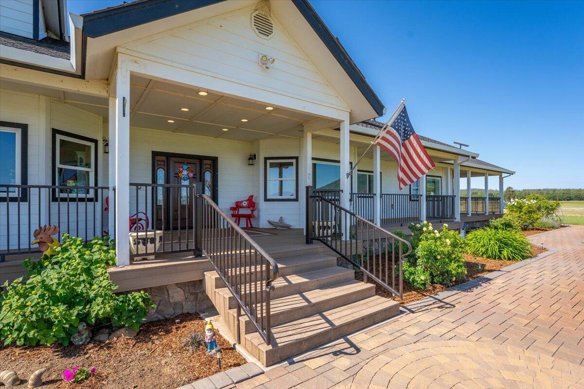 41494 Gomez Road Fall River Mills, CA 96028 - Photo 42 of 92 a view of a house with entrance and a porch