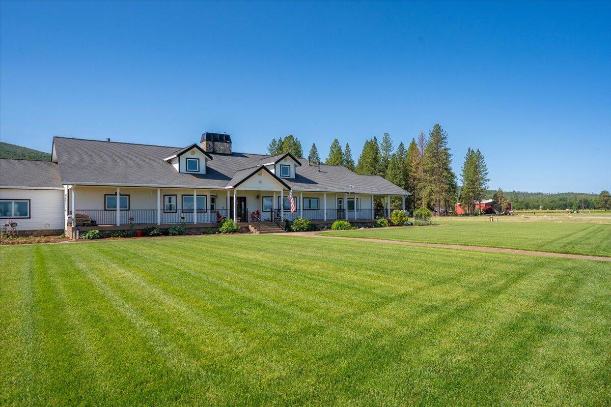 41494 Gomez Road Fall River Mills, CA 96028 - Photo 49 of 92 a front view of house with yard and outdoor seating