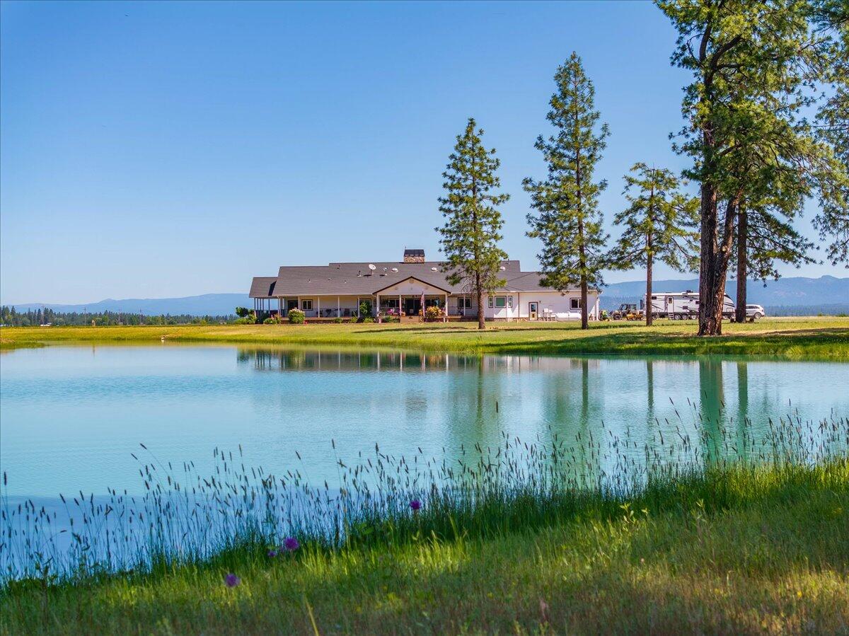 41494 Gomez Road Fall River Mills, CA 96028 - Photo 7 of 92 a view of a lake with houses in all around