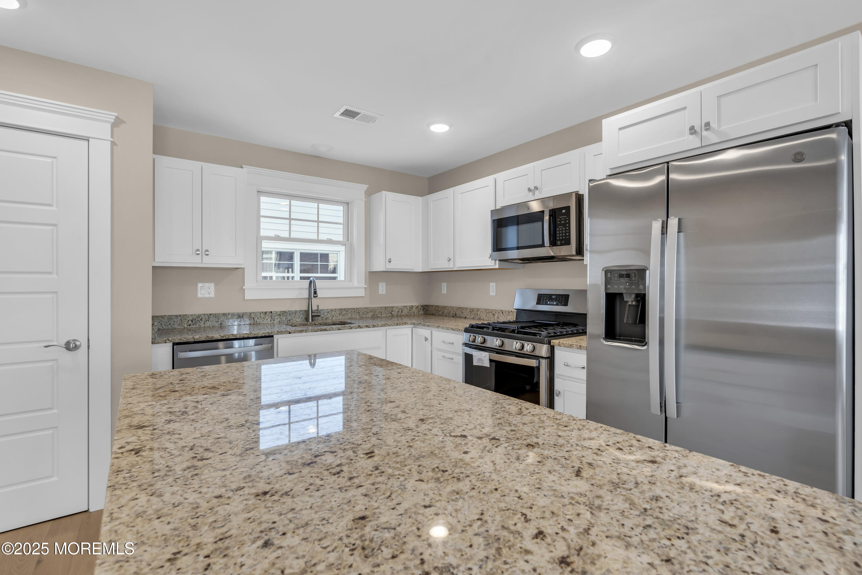 24 Shell Road, Unit 126 Mantoloking, NJ 08738 - Photo 16 of 31 a kitchen with stainless steel appliances granite countertop a refrigerator stove top oven and sink