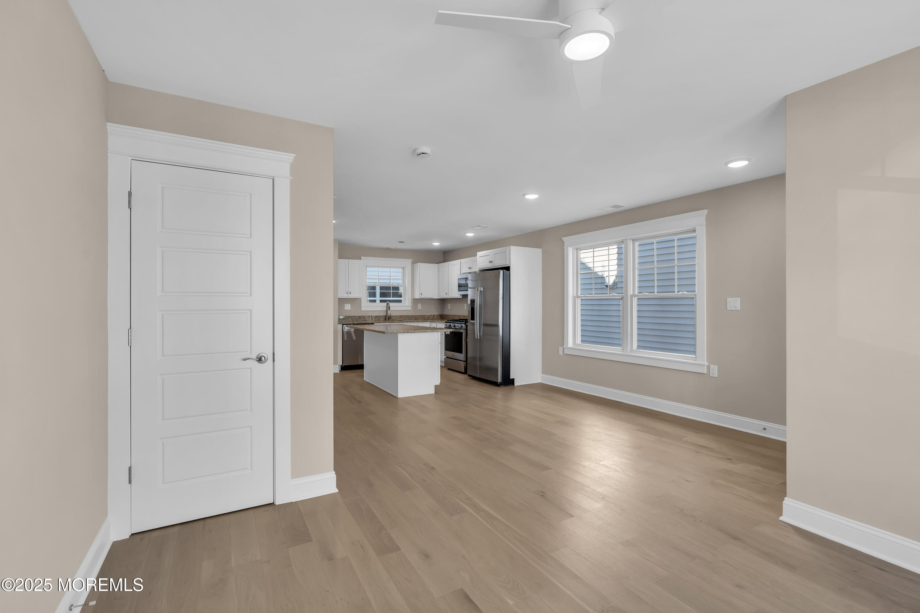 24 Shell Road, Unit 126 Mantoloking, NJ 08738 - Photo 17 of 31 an empty room with wooden floor and windows