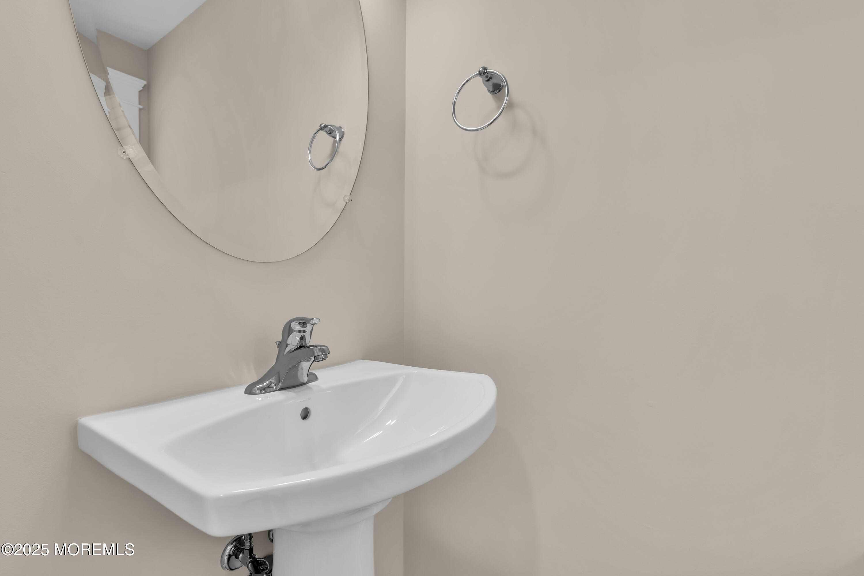 24 Shell Road, Unit 126 Mantoloking, NJ 08738 - Photo 20 of 31 a bathroom with a sink a mirror and a vanity