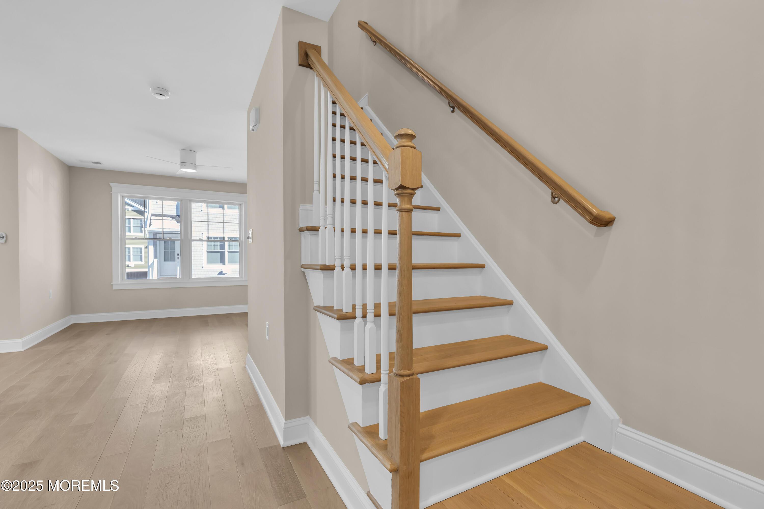 24 Shell Road, Unit 126 Mantoloking, NJ 08738 - Photo 21 of 31 a view of entryway with wooden floor and stairs