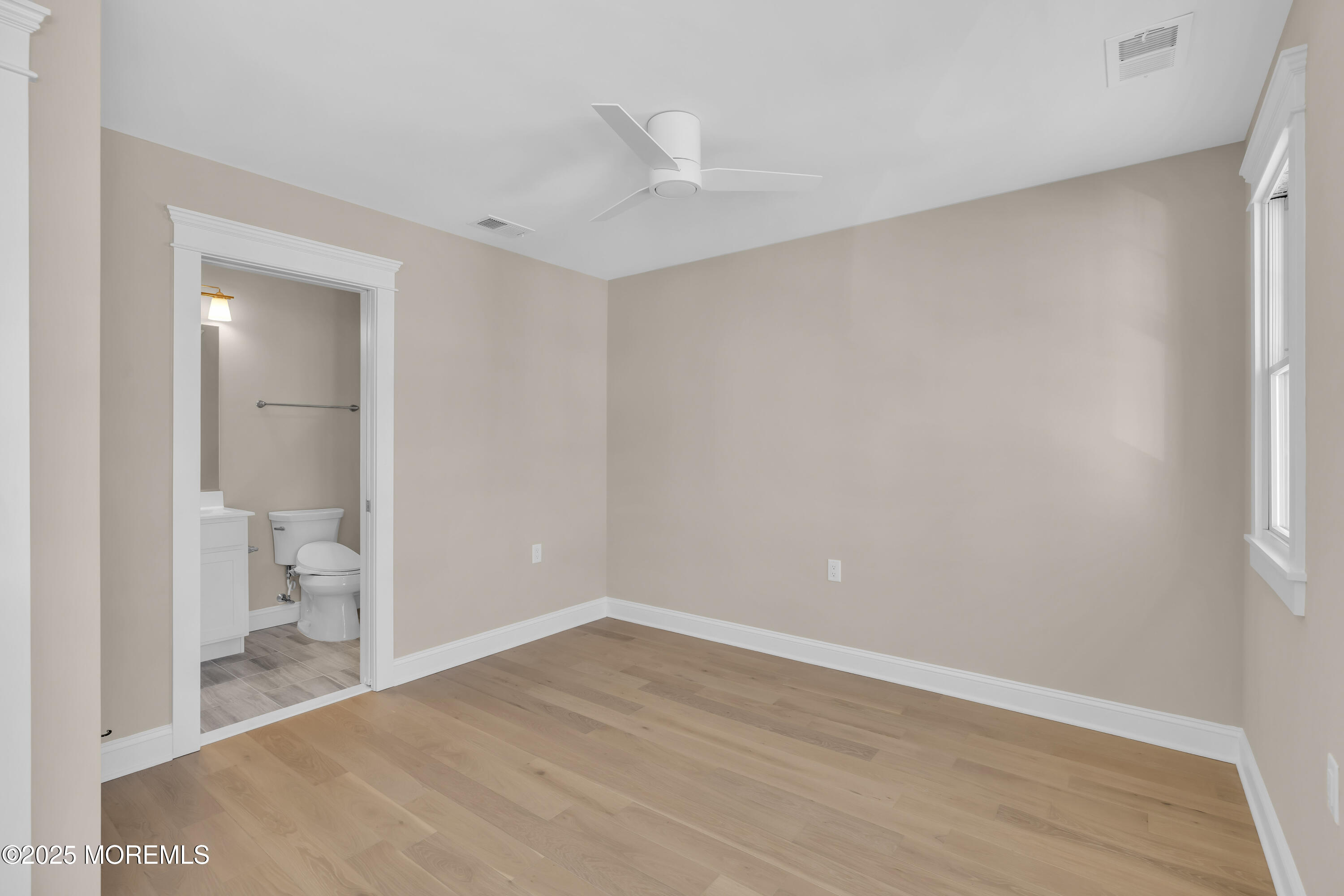 24 Shell Road, Unit 126 Mantoloking, NJ 08738 - Photo 25 of 31 a view of room with wooden floor and a toilet