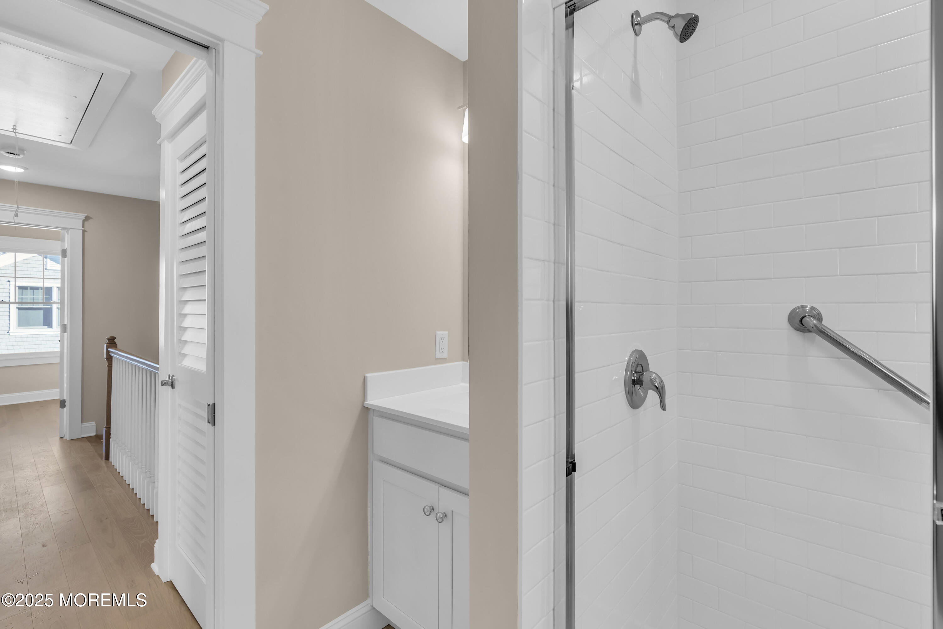 24 Shell Road, Unit 126 Mantoloking, NJ 08738 - Photo 26 of 31 a view of a bathroom from a hallway