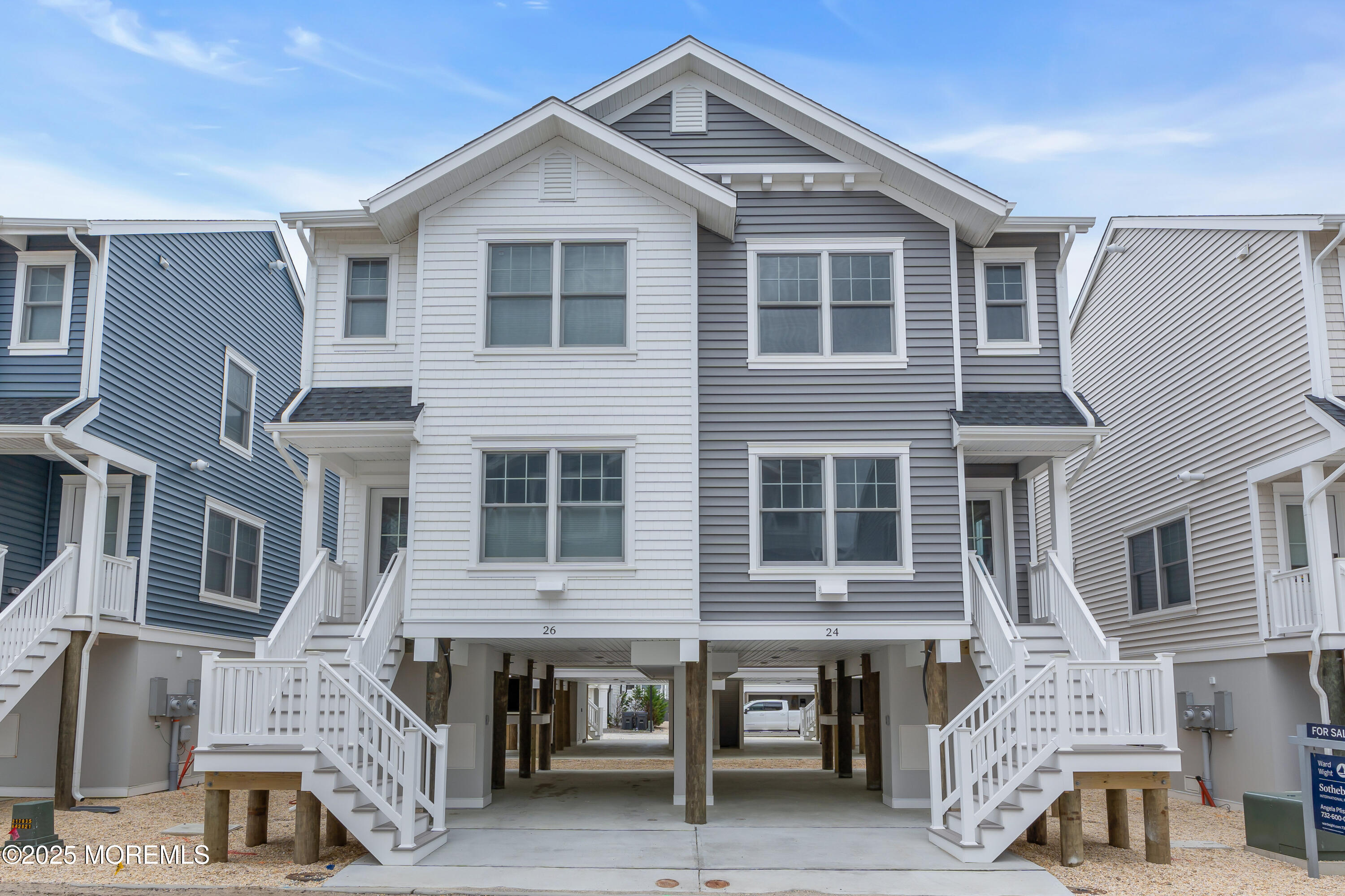 24 Shell Road, Unit 126 Mantoloking, NJ 08738 - Photo 3 of 31 a front view of a house with balcony